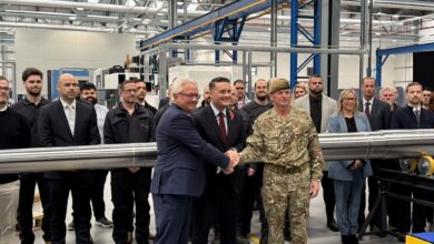 Defense officials attend the opening of Rheinmetall's new arms facility.