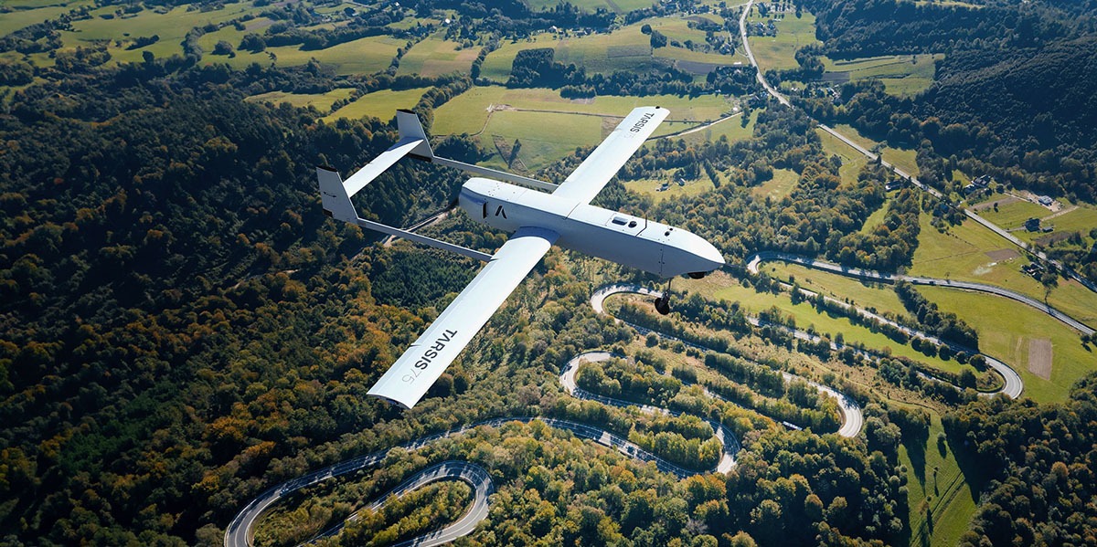 Indra’s TARSIS unmanned aerial system in flight over mountainous terrain. Photo: Indra