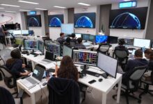 Argotec staff monitors launch of satellite.