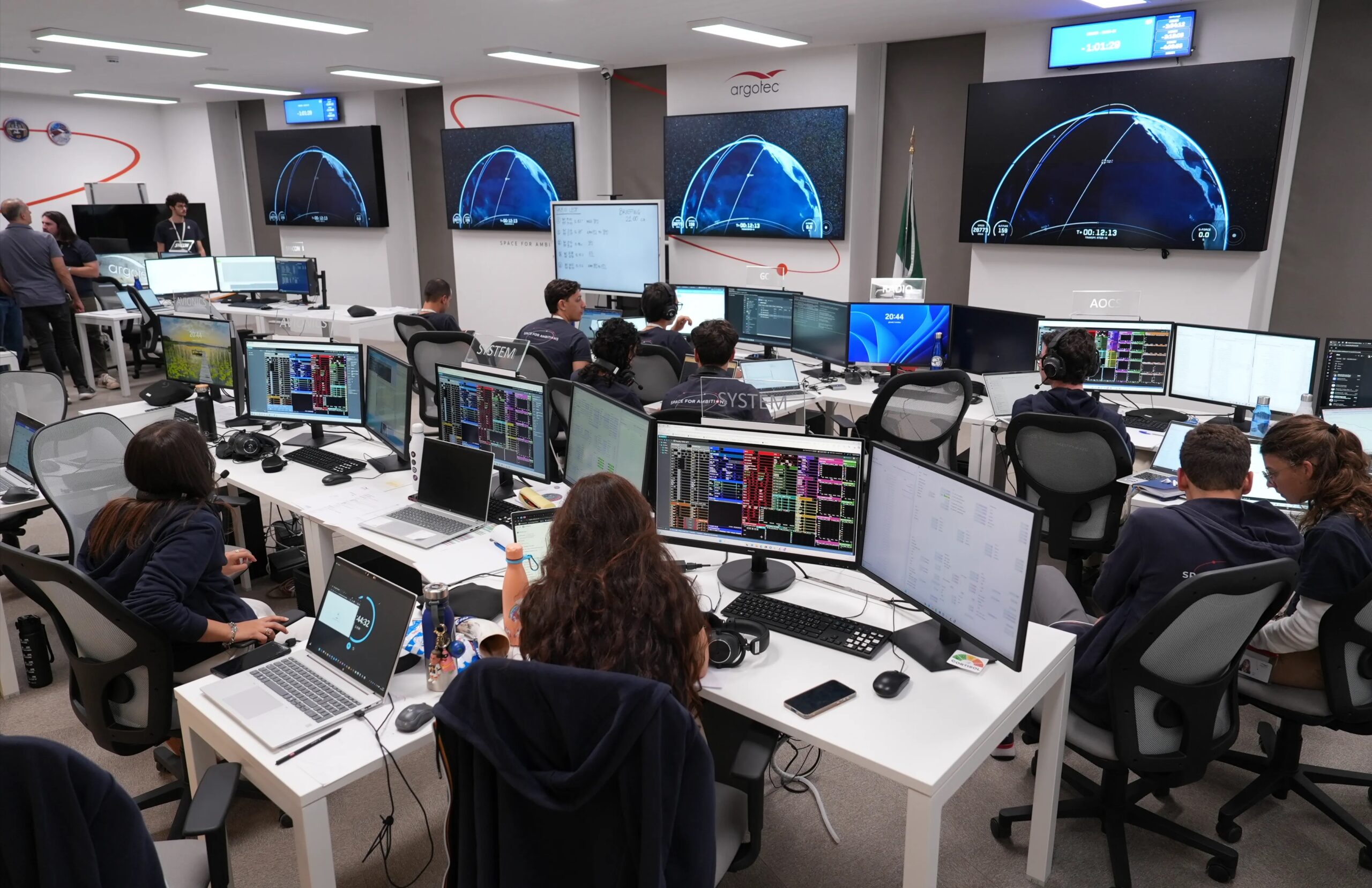 Argotec staff monitors launch of satellite.