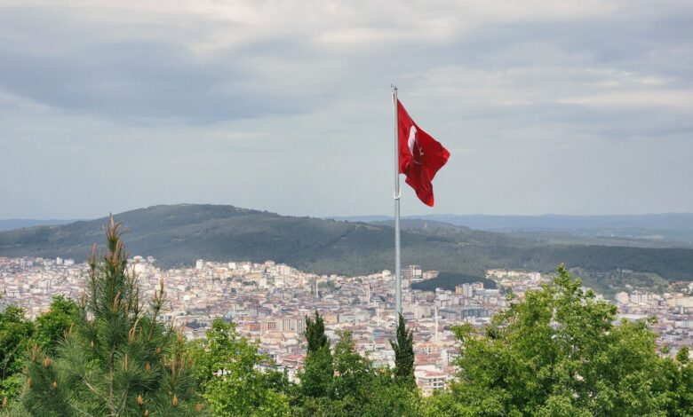 The Turkish flag overlooks a city in Turkey. Photo: Kübra Nûr Şahin/Pexels.