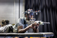 Soldier testing head-mounted equipment