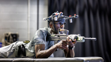 Soldier testing head-mounted equipment