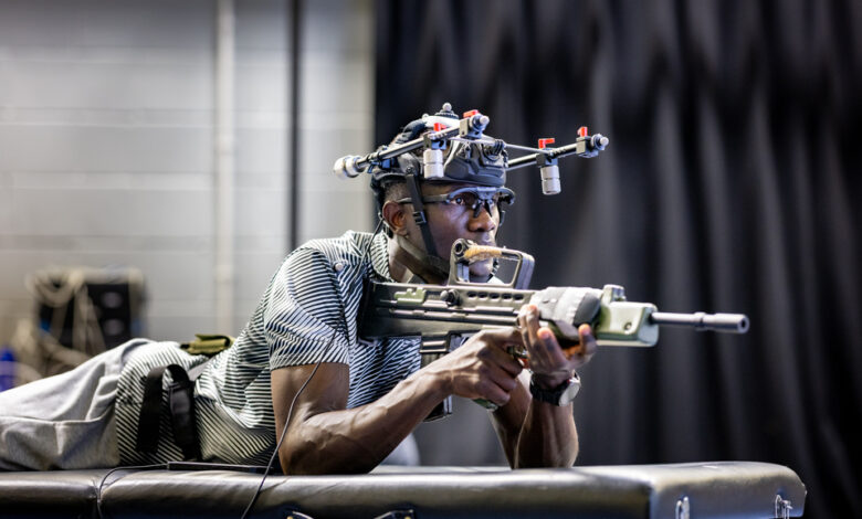 Soldier testing head-mounted equipment